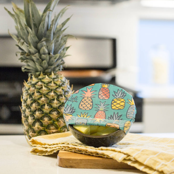 Pineapple Print Beeswax Wrap Covering a Bowl of Pineapple Chunks | Meli Wraps® | Keeping It Pretty @ Spice Craze®