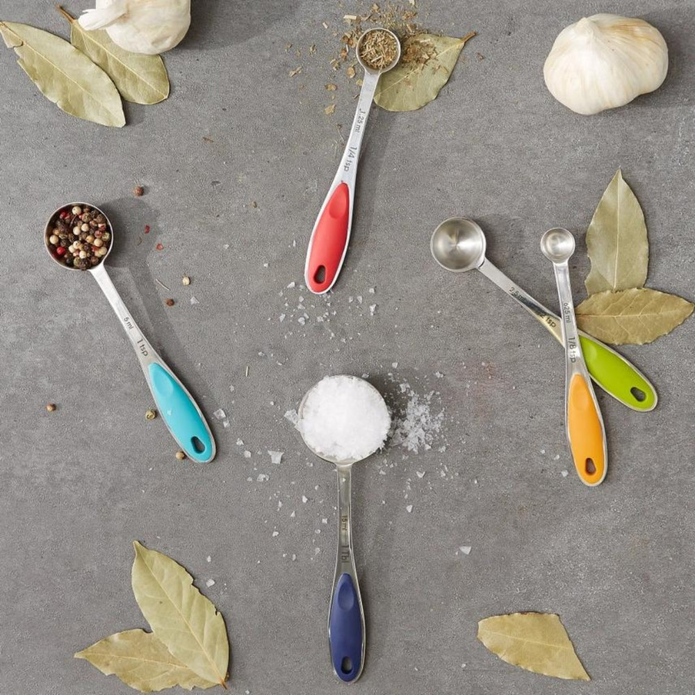 Colored-Handle Measuring Spoons on a Concrete Countertop with Herbs and Spices | Set of 5 | RSVP International | Measuring & Mixing @ Spice Craze®