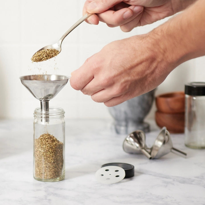 Transferring Herbs to a New Spice Bottle with the Set of Three Stainless Steel Funnels | Fox Run Brands™ | Measuring & Mixing @ Spice Craze®