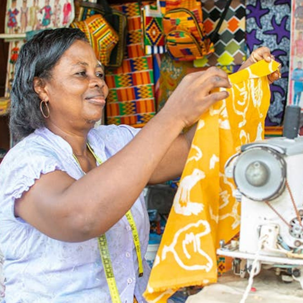 A Global Mama Sewing a Kid's Apron - White Chickens on a Sunny, Golden-Yellow Background | Global Mamas® | Aprons & Linens @ Spice Craze®