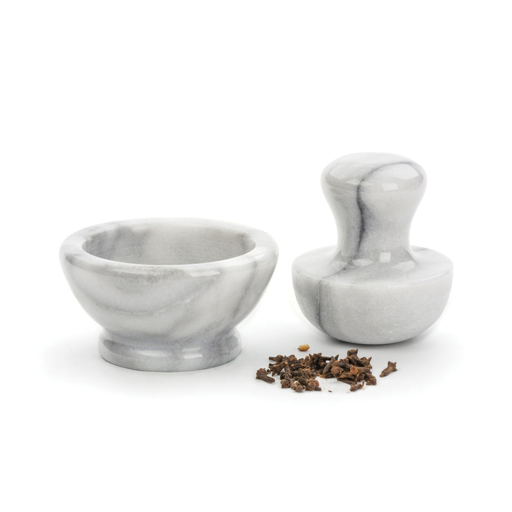 White Marble Spice Grinder with Cloves in the Foreground | RSVP International | Mortars @ Pestles @ Spice Craze®