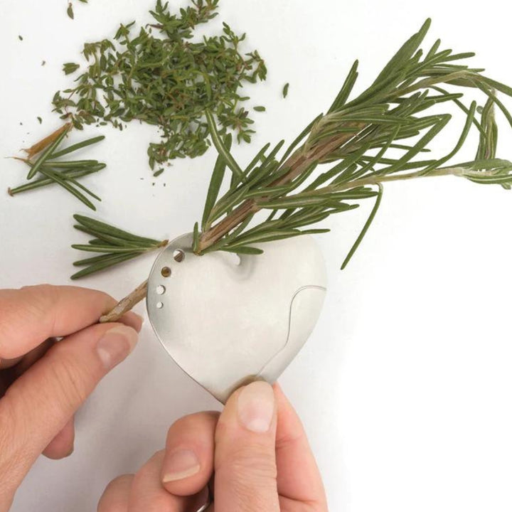 Pulling Rosemary through a Heart-Shaped Stainless Steel Herb Stripper | RSVP International | Grate, Strip, & Zest @ Spice Craze®