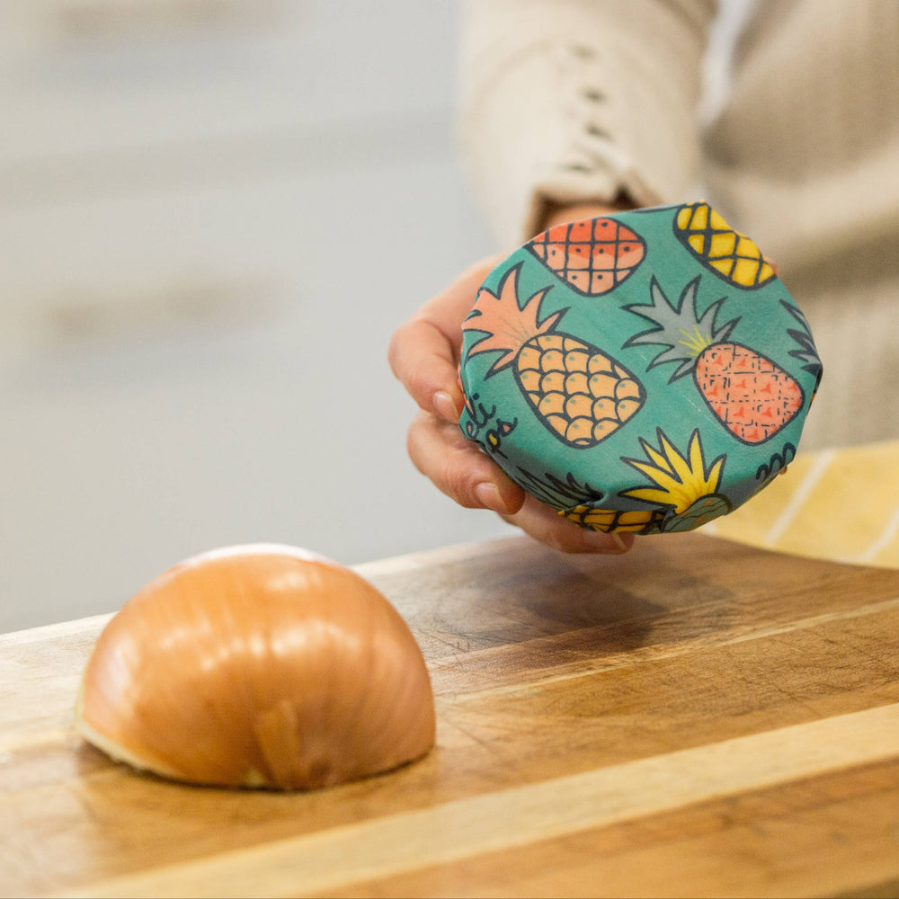 Pineapple Print Beeswax Wrap Covering Half an Onion | Meli Wraps® | Keeping It Pretty @ Spice Craze®