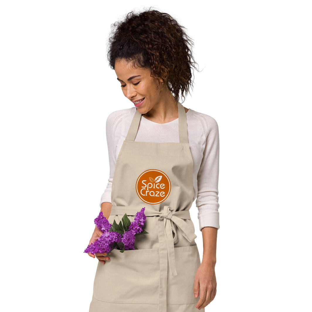 Orange-Colored Logo Organic Cotton Apron with Flowers in the Pocket | Spice Craze® Merch @ Spice Craze®