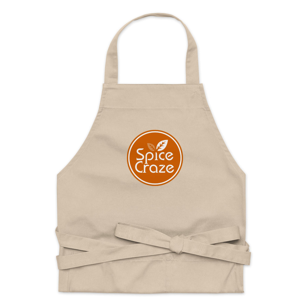 Folded Orange-Colored Logo Organic Cotton Apron | Spice Craze® Merch @ Spice Craze®