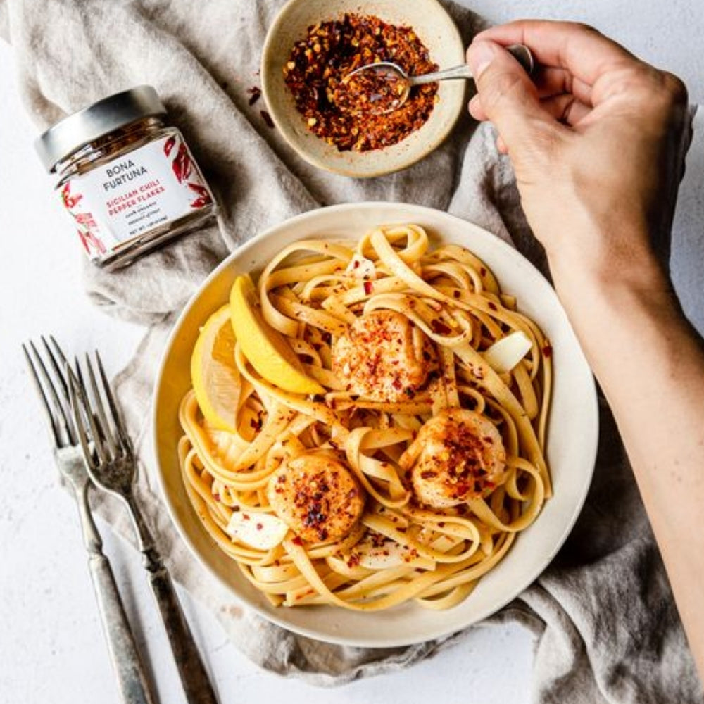 Organic Sicilian Chili Pepper Flakes Sprinkled Over Tagliatelle | Bona Furtuna | Awesome Extras @ Spice Craze®